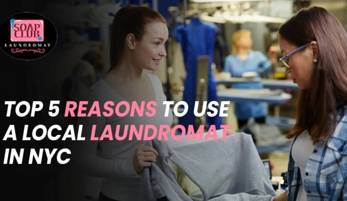 Two women at a laundromat discussing freshly cleaned clothes with Soap Club Laundromat logo displayed.