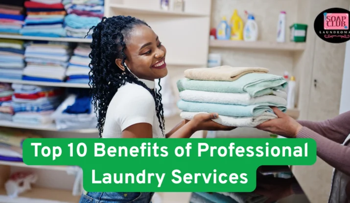Smiling woman receiving folded towels from a laundromat staff member in a professional laundry setting.